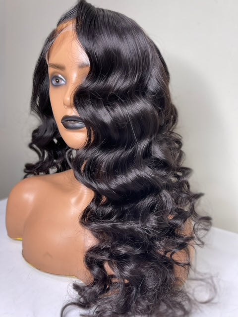 Front of Frontal HD Lace human hair wig natural brown color with wavy curls